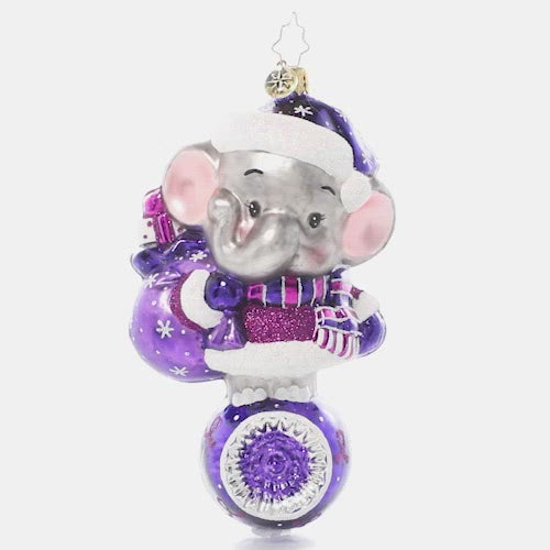 Video - Ornament Description - Love Never Forgets: With big ears and an even bigger heart, an adorable elephant dons all his purple duds in honor of Alzheimer's Awareness. After all, an elephant never forgets, and he wants us to remember this important cause too! A percentage of the sales from this ornament will benefit Alzheimer's charities. This video shows the ornament slowly spinning,