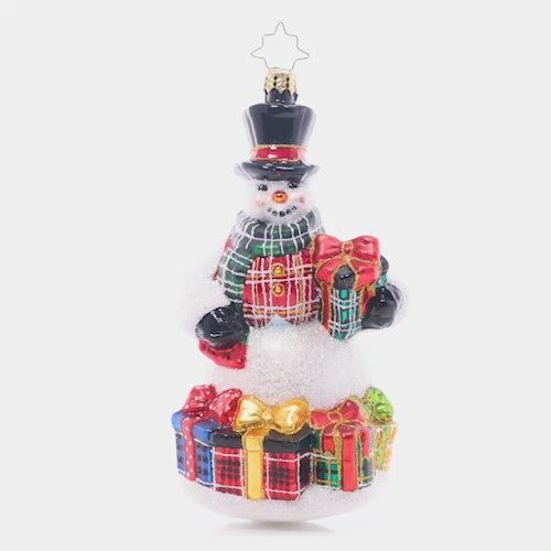 Video - Ornament Description - Plaid Perfection: It's that time of year to wear the holiday plaid, to show it's more than a fad. With presents to match, this snowman is quite the dashing catch! This video shows the ornament spinning slowly. 