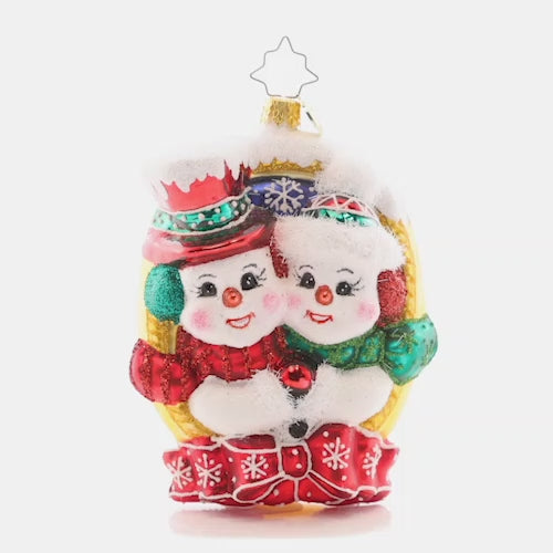 Video - Ornament Description - A Picture Perfect Pair: These snow-sweeties are cheesing for the camera. They'll make the most picturesque pair on your tree this year, framed in gold and wrapped up in a bow!