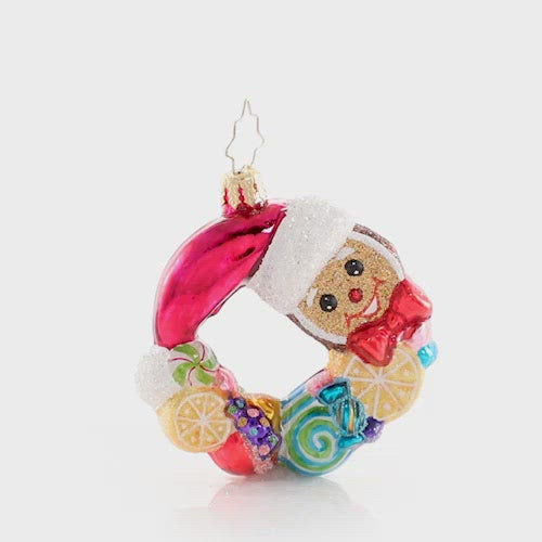 Video - Ornament Description - Swirling With Sweets Wreath Gem: Forget visions of sugarplumsâ€¦between all these swirling lemons, peppermints, and other treats this little gingerbread man is sure to have some very sweet dreams! This video shows the ornament spinning slowly. 