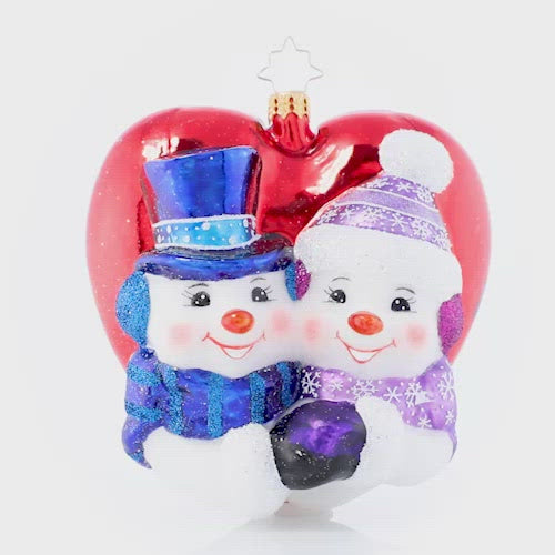 Video - Ornament Description - A Frosty First Christmas Personalized: They may be made of snow, but they have got their love to keep them warm! This heart-shaped ornament celebrates new love and the thrill of a first holiday spent together. Note: Please allow approximately one month (on top of shipping time) for our elves to personalize your ornament.