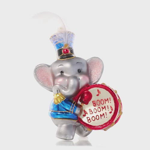 Video - Ornament Description - Keep Good Time: Parum-pum-pum-pum – This adorable elephant drummer boy makes sure the beat goes on! He's looking dapper in his special holiday uniform and feathered cap. This video shows the ornament slowly spinning. 
