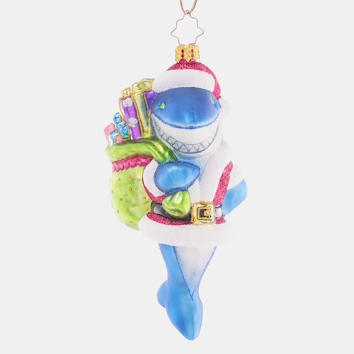 Video - Ornament Description - Santa Jaws: Shining and smiling with a bag full of gifts, this jolly Santa-Jaws ornament is nothing to be afraid of! He's spreading Christmas cheer all across the deep blue sea with his bounty of presents. This video shows the ornament spinning slowly. 