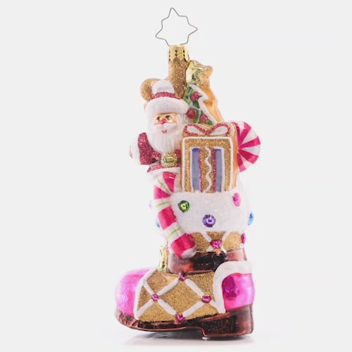 Video - Ornament Description - Treat Yourself Boot: This festively-frosted gingerbread boot is filled to the brim with sweet treats and surprises, baked with love by Santa himself. This video shows the ornament spinning slowly. 