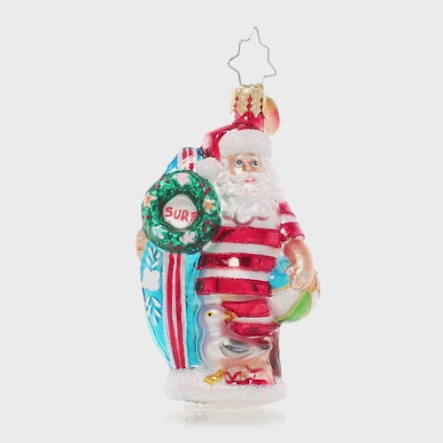 Video - Ornament Description - Wishing For Waves Santa Gem: Ho-ho-hang ten! Santa looks ready to catch a wave as he waits for the surf report holding his bright blue surfboard. This video shows the ornament spinning slowly. 