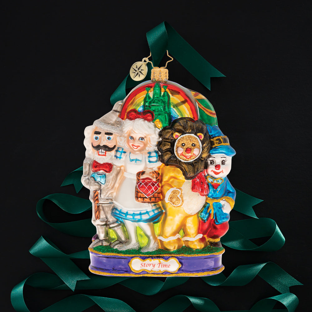 Ornament Description - The Land Of Oz: Mrs. Claus and friends are most certainly not in Kansas anymore. It's Christmastime in the Land of Oz, and just down the yellow brick road, there's a host of holiday adventures in store.